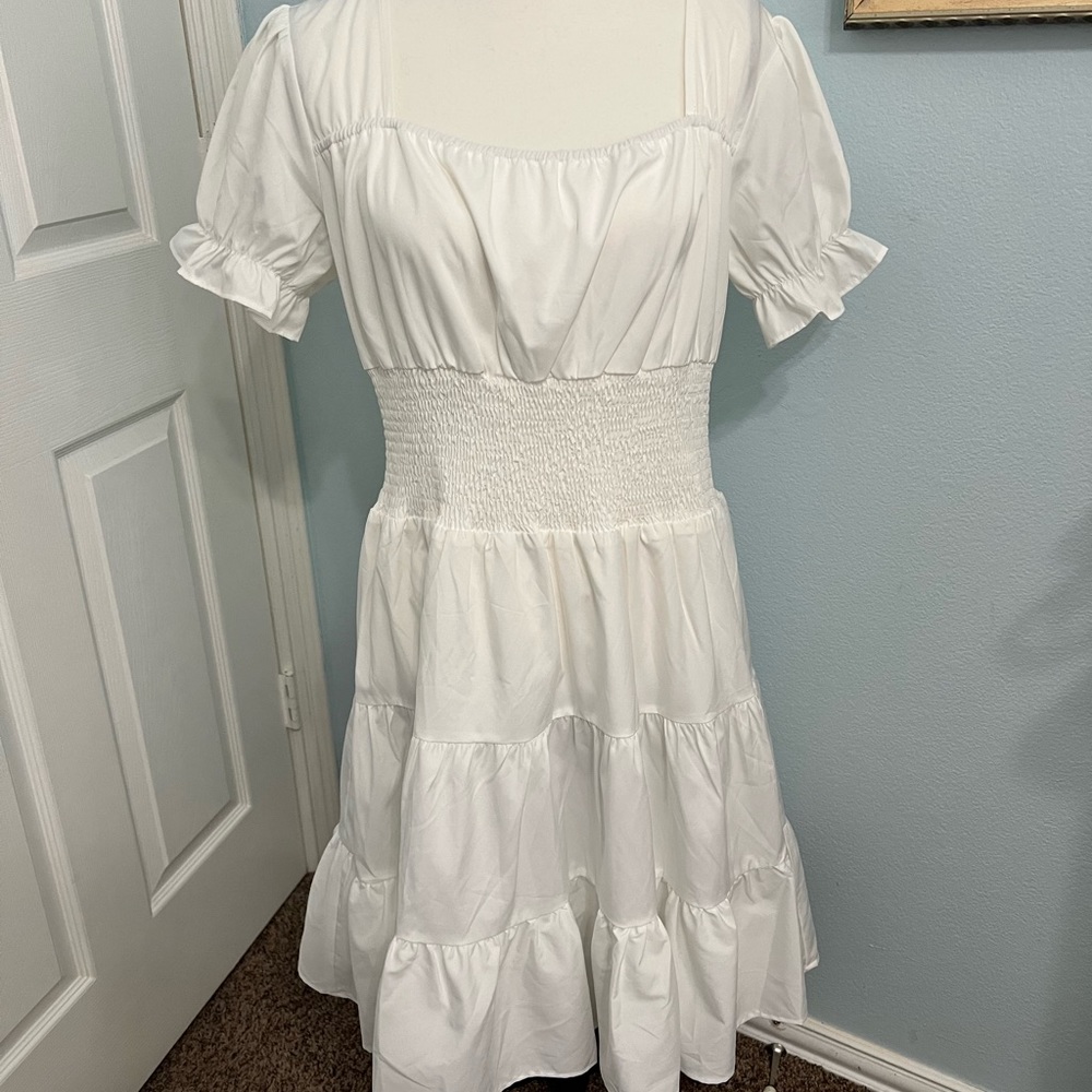 White dress with faltering waste.